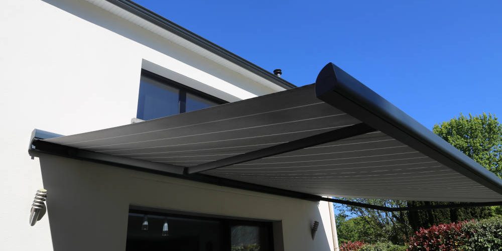 Electric aluminum modern awning on a modern house Electric aluminum modern awning on a modern house